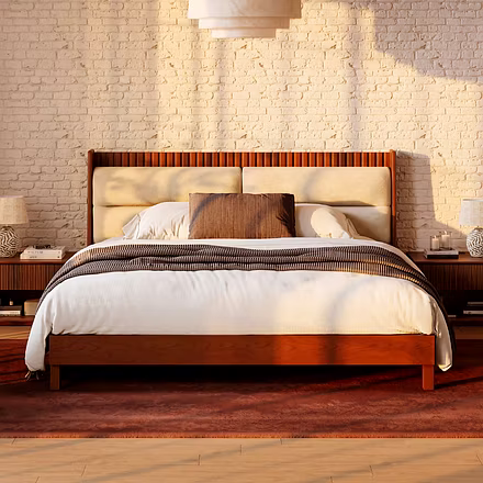 Front view of king or queen size teakwood bed with padded headboard and vertical teak slat detailing
