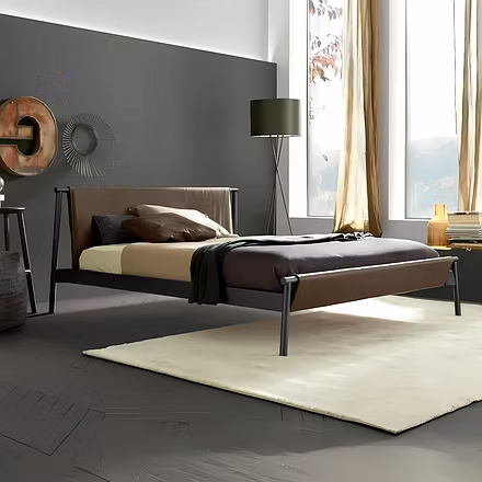 Modern bedroom setup featuring Master Teakwood Bed with brown leather headboard and matching footboa