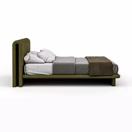 Side view of Drift upholstered bed showing low platform, rounded perimeter base and doubled headboar