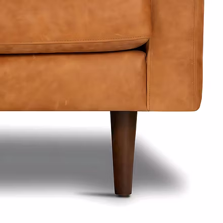 Close-up of tan Alba L Shape Sofa wooden tapered leg