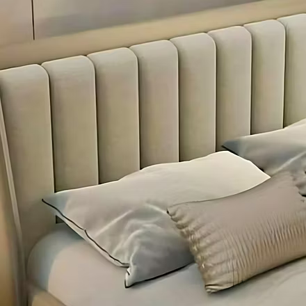 Close-up view of the right side of the Linea upholstered bed (king and queen sizes) focusing on the 