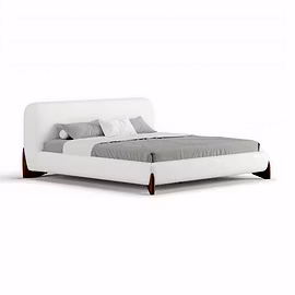 A white Ashlie upholstered bed with curved headboard and walnut wood legs on a plain background, ava