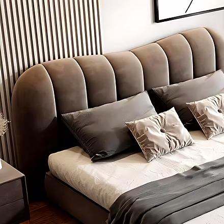 Close-up of Elle Upholstered Bed’s curved headboard design, soft cushioned detailing – King and Quee