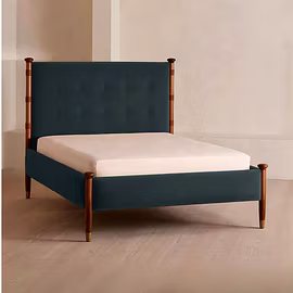 Victorian upholstered bed with teakwood pillars – side angle view in king and queen size by Woodkraf