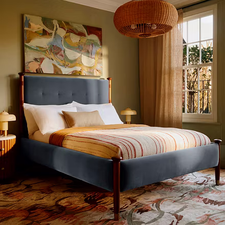 Victorian upholstered bed styled in a bedroom setup with teakwood pillars, luxury upholstery, king a