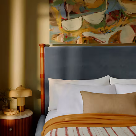 Headboard design of Victorian upholstered bed with teakwood pillars and tufted upholstery – availabl