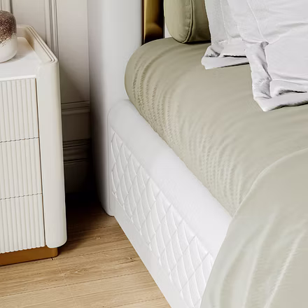 Close-up of beige upholstered bed with quilted detailing, Tune customisable king and queen bed.