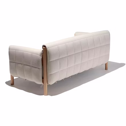 (Back View): Rear view of teakwood sofa showing quilted fabric detailing and solid wooden structure.
