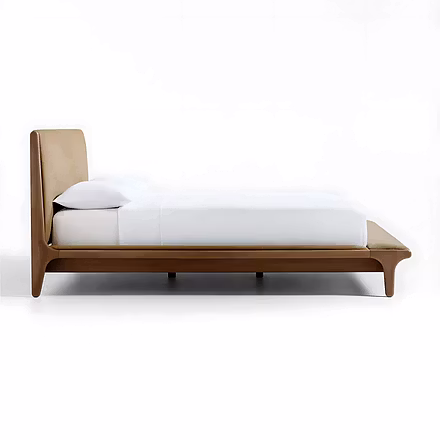 Side profile of teakwood bed highlighting low platform and rounded legs with padded foot bench, show