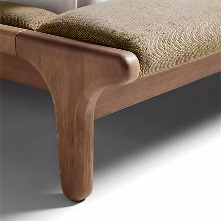 Detailed view of teak frame joint and padded footboard bench upholstery illustrating craftsmanship —