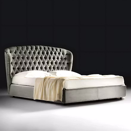 Stars upholstered bed in grey velvet with gently curved headboard, set in a contemporary bedroom (av
