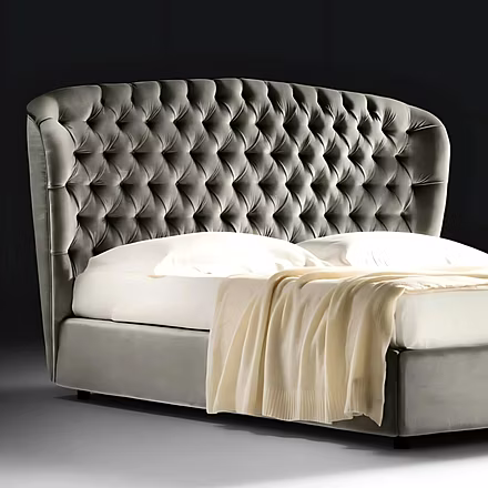 Close-up of the Stars bed’s luxurious upholstered headboard and solid wood frame finish.