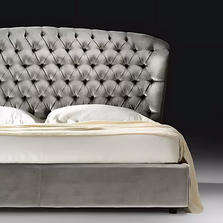 Close-up of the Stars bed’s luxurious upholstered headboard and solid wood frame finish.