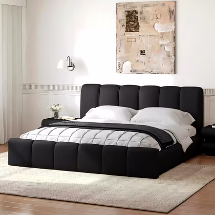 Angled side shot of black Atlas bed frame with fully cushioned base – King and Queen platform bed