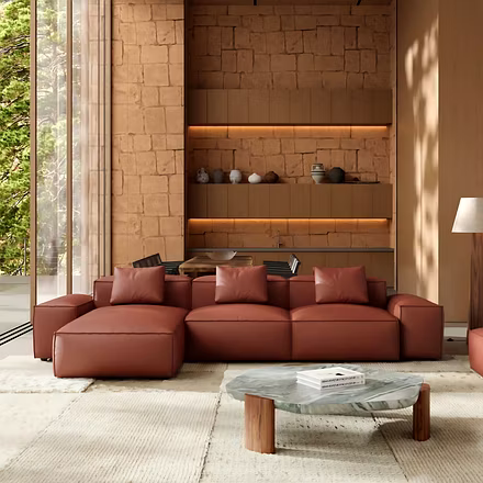 brown: “Opulence L shape sofa three-quarter front view in brown leather — modular chaise right”