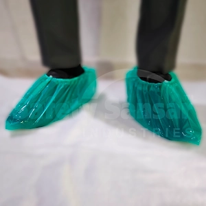 Disposable Plastic Shoe Cover Green, a packet of 100 pcs