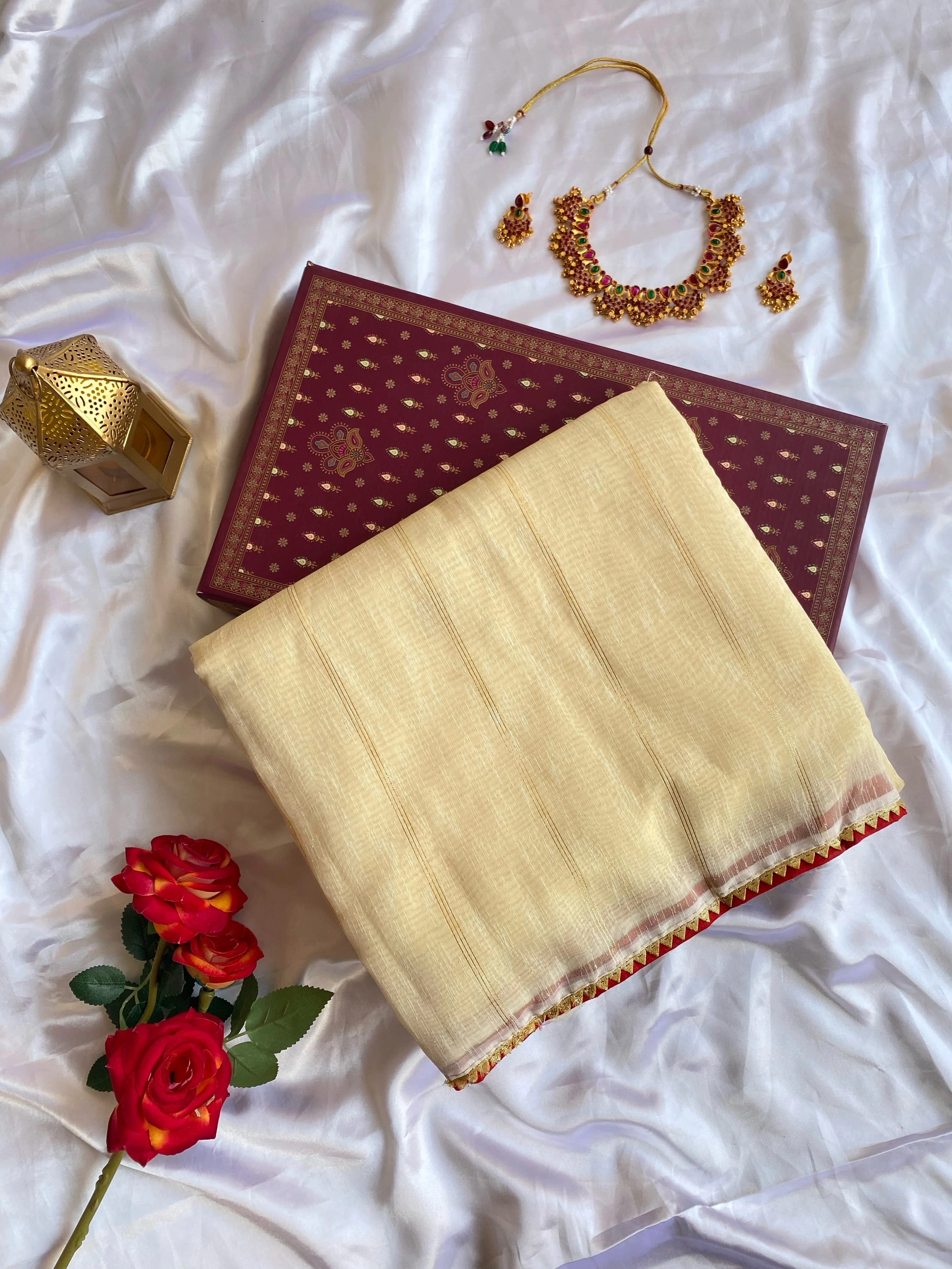 White soft tissue saree with a fancy temple lace border, zari stripes, and paired with a stitched padded Bandhani blouse-White-1