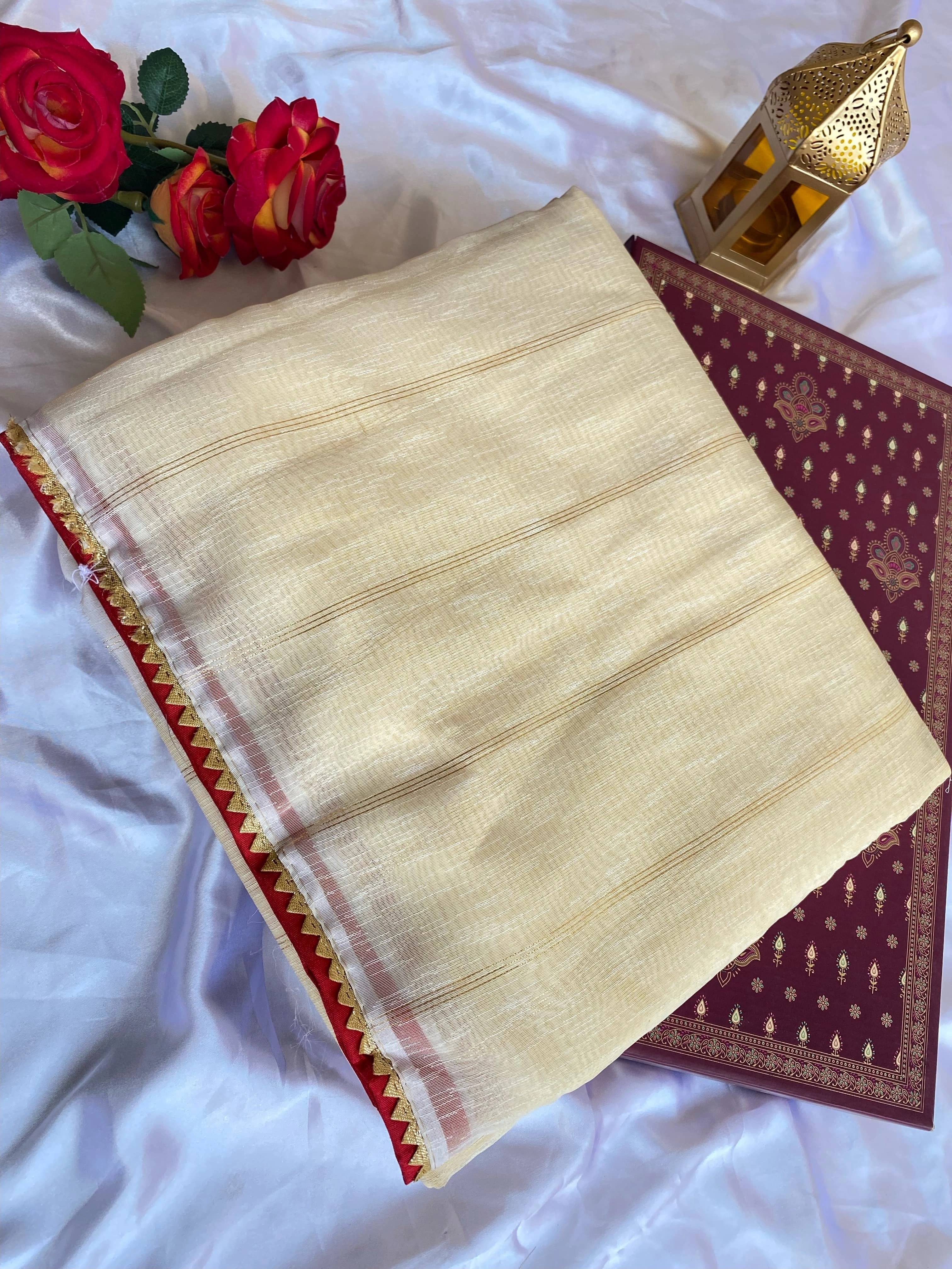 White soft tissue saree with a fancy temple lace border, zari stripes, and paired with a stitched padded Bandhani blouse-White-3