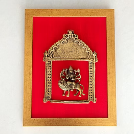 majestic brass prabhavali with goddess durga framed on deep red raw silk . frame height 45 cm x width 35 cm weight: 3.0 kg pif-2614