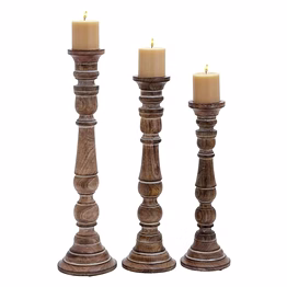 a set of three wooden candle holder