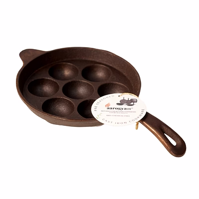 aarogyam cast iron paniyaram pan 7 cavity , handle with ring at bottom for support, pre-seasoned 7.5 inch diameter (19 cm), naturally non-stick, toxin-free, gas & induction compatible, weight- 1.9 kg