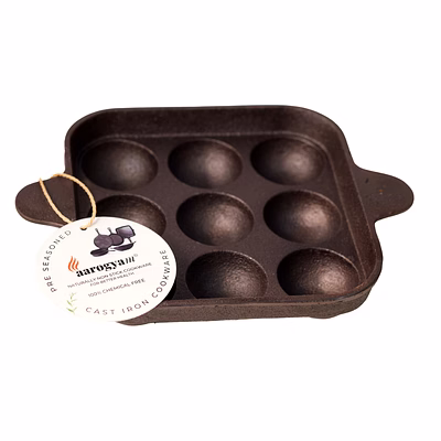 aarogyam cast iron paniyaram pan 9 cavity , pre-seasoned 7 inch diameter (17cm), naturally non-stick, toxin-free, gas & induction compatible, weight- 1.4 kg