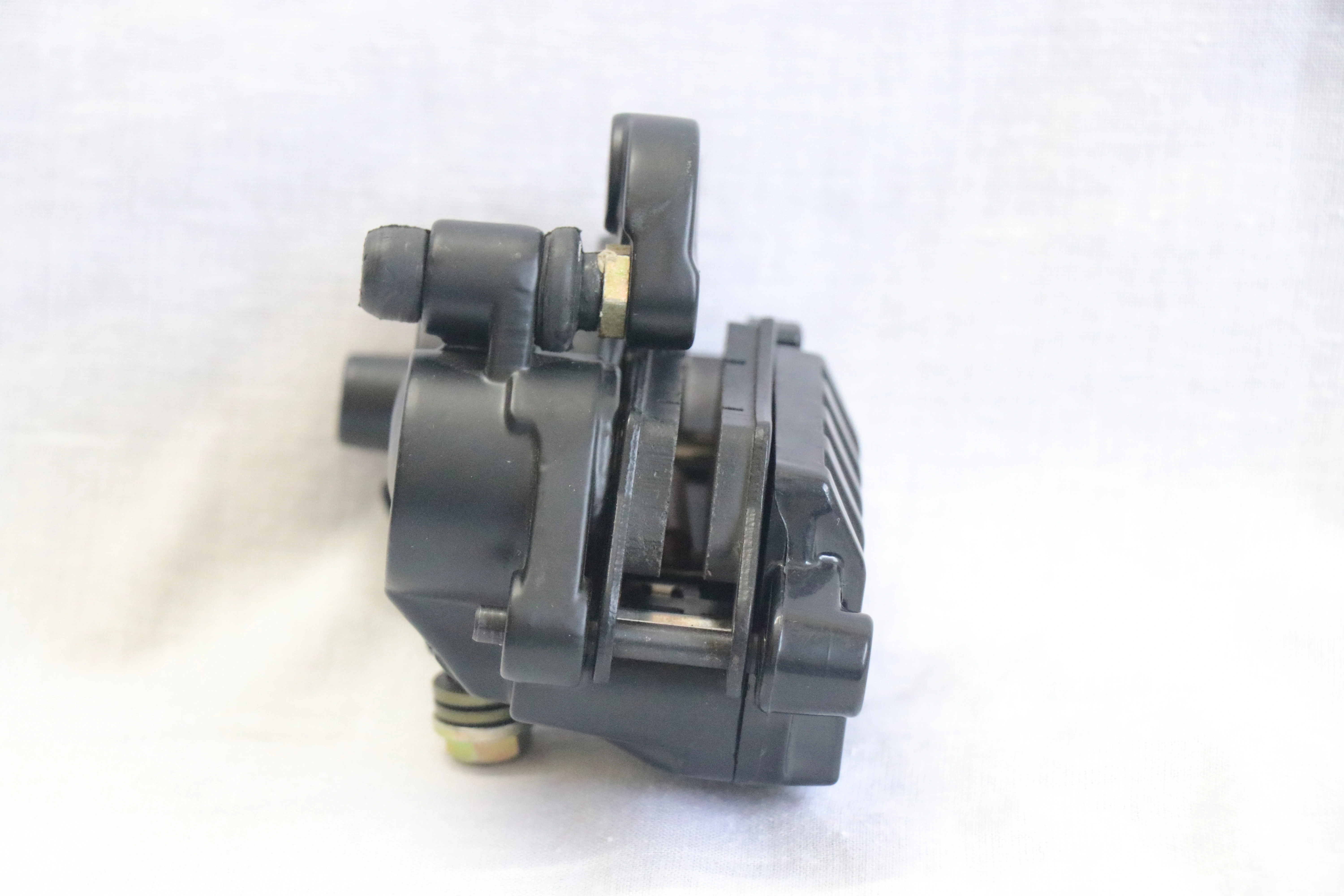 Pulser Brake Caliper - Brake caliper assembly designed for use with Pulser motorcycles.