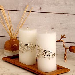 2 candles with silver plated brooch