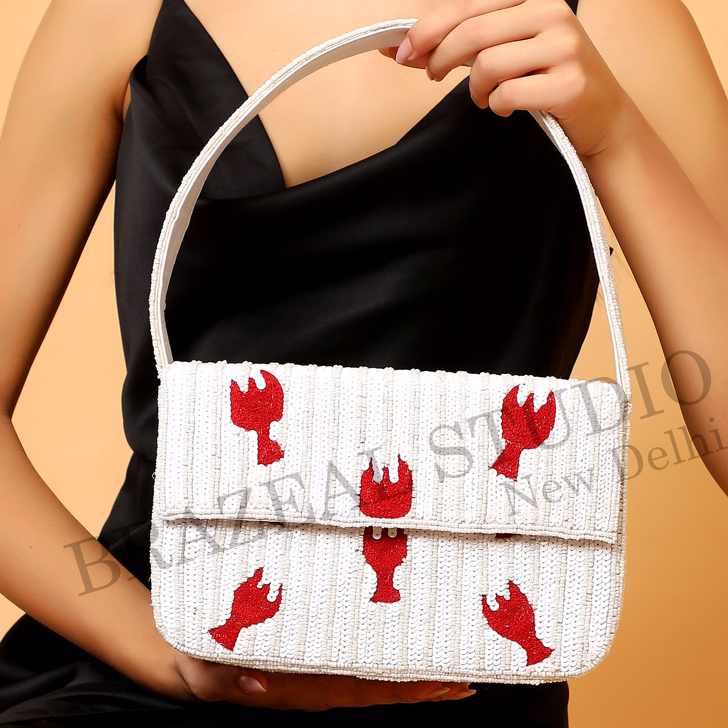 brazeal studio, bag, hand-beaded lobster motif, white base with red lobster embroidery, shoulder bag with flap closure, fabric base with sequin and bead embellishment, front flap