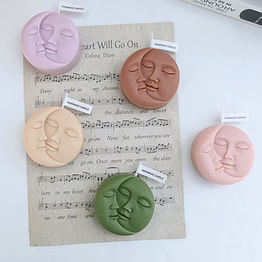 handcrafted moon-faced scented candles