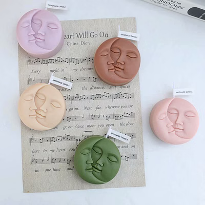 handcrafted moon-faced scented candles