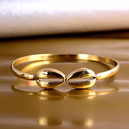 artistically crafted brass cowrie bracelet cuff