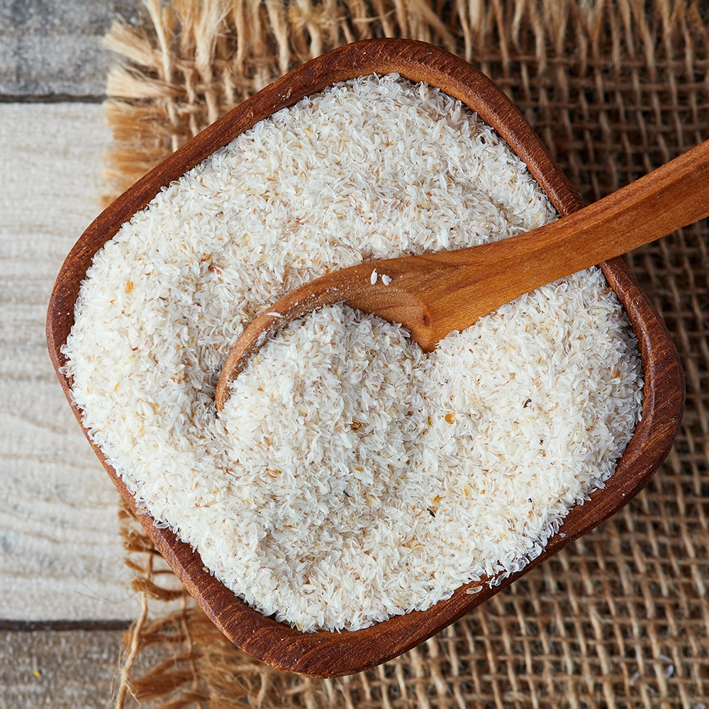 Image showing a pile of psyllium husk powder on a wooden spoon, emphasizing its natural dietary supp