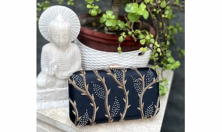 Black Clutch with Gold Zardozi work and small pearl embellishments.Size 20*12*5.50cm.