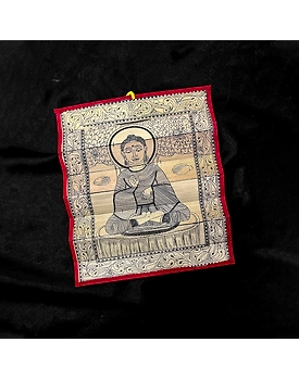 Palm leaf engraving of meditating Buddha