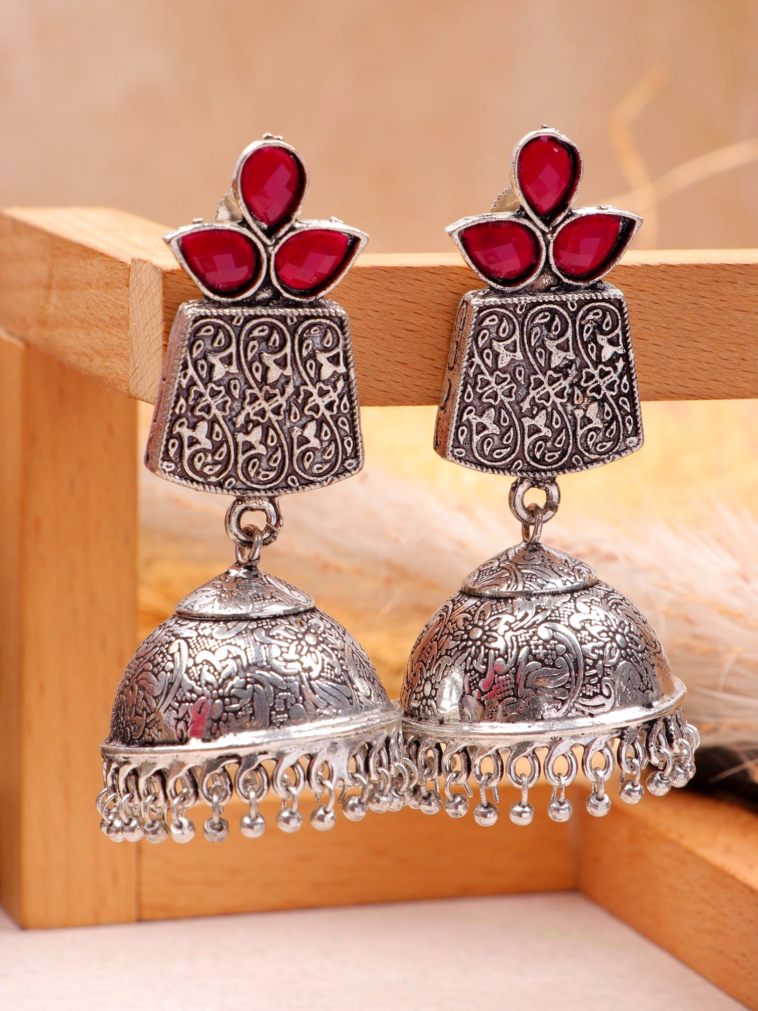 gonasika exquisite oxidised silver tone red stone dome jhumka earrings for women