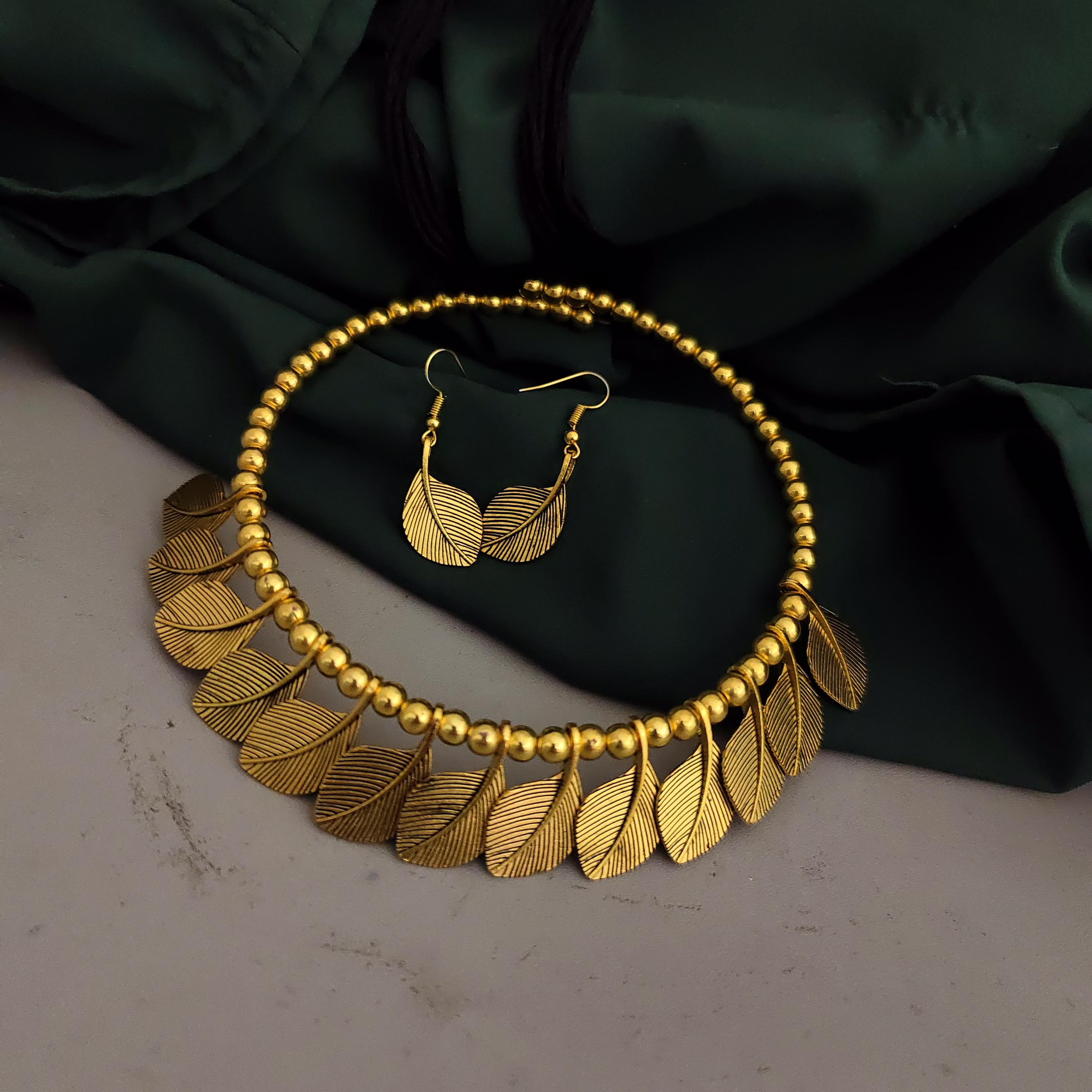 gonasika oxidised golden leaf choker necklace earrings set